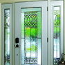 exterior view of single white entrance door with sidelites featuring decorative glass