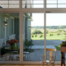 interior view of white vinyl three panel patio door with decorative trim