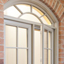 exterior view of open cream stained vinyl casement window with shaped transom featuring grills