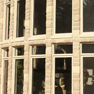 exterior patio view of set of ten sandstone stained vinyl casement and fixed windows