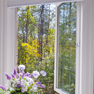 interior bathroom view of open white casement windows