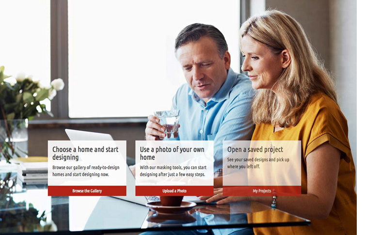 Husband and wife sit together at glass dining room table looking at a laptop computor. Click here to launch the Strassburger window visualiser app